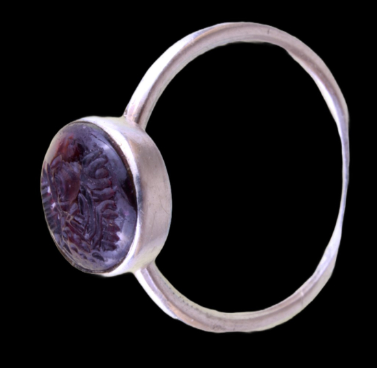Silver ring with red, brown stone with engraving