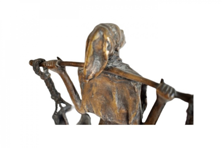 A bronze statue of a water carrier