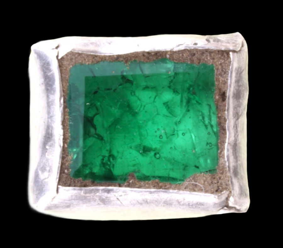 Silver cufflink with green stone