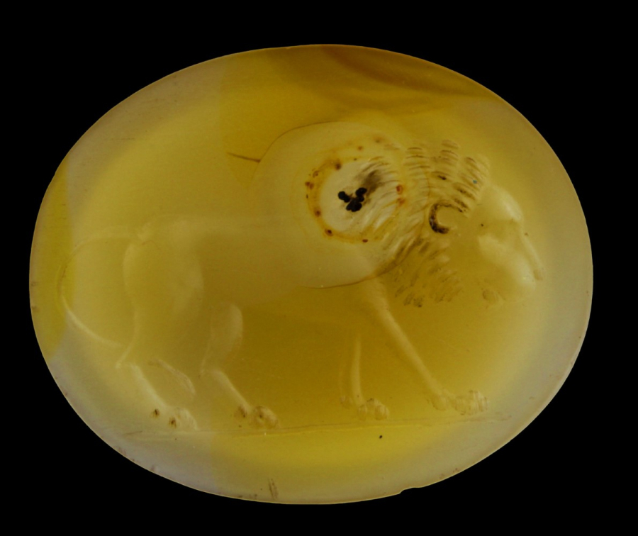 Yellow stone with an engraving of a lion