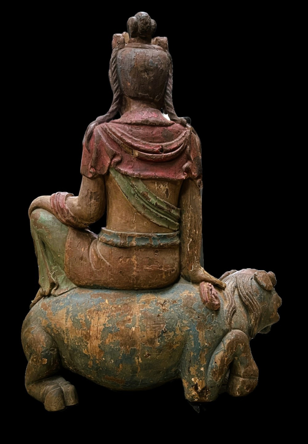 Chinese wooden statue of Buddha on a Fu dog