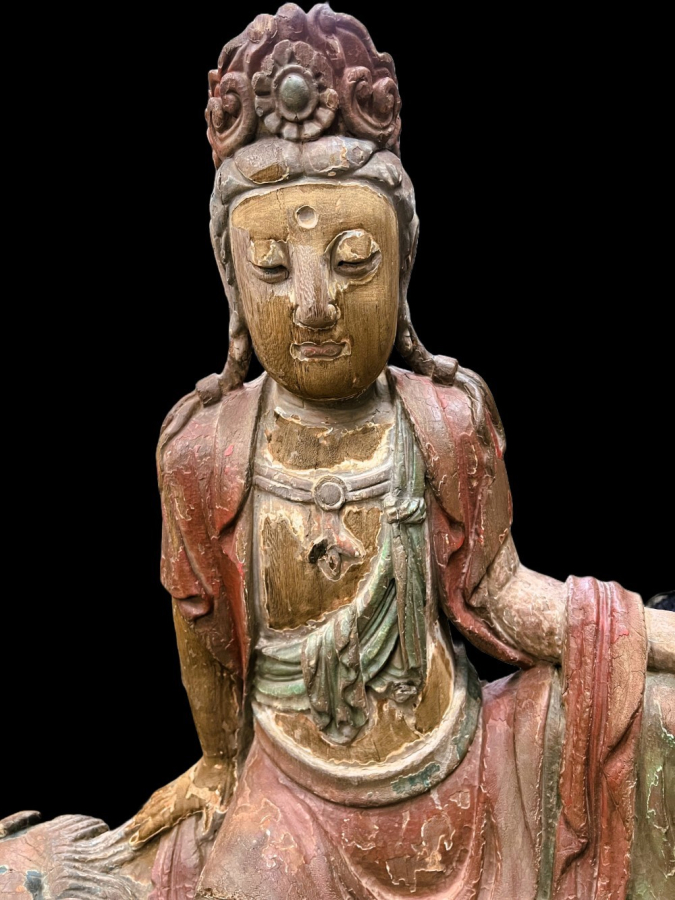 Chinese wooden statue of Buddha on a Fu dog