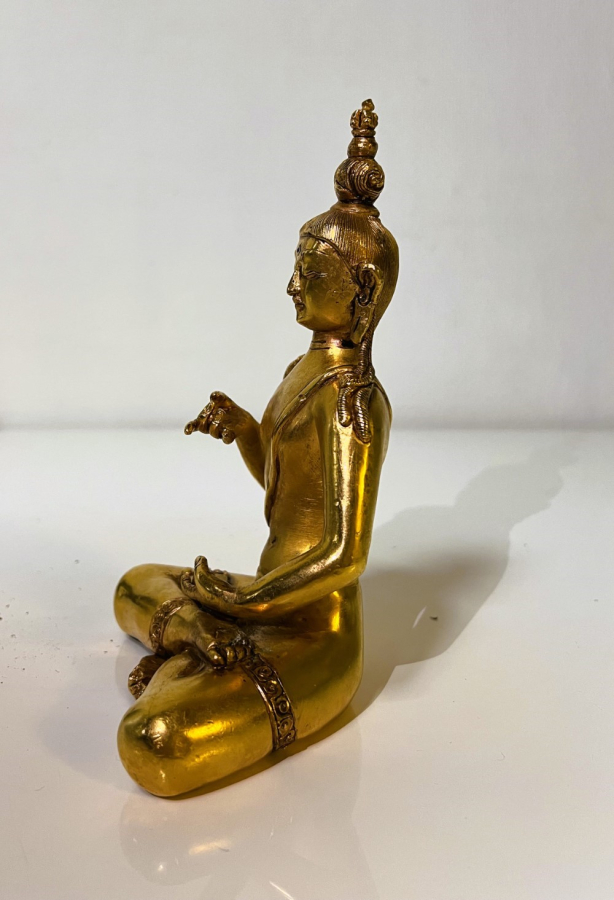 Gold colored Indian statue of Buddah