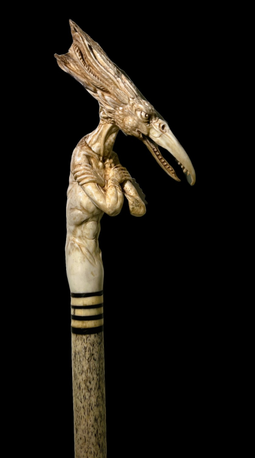 Walking cane with bird figure on top