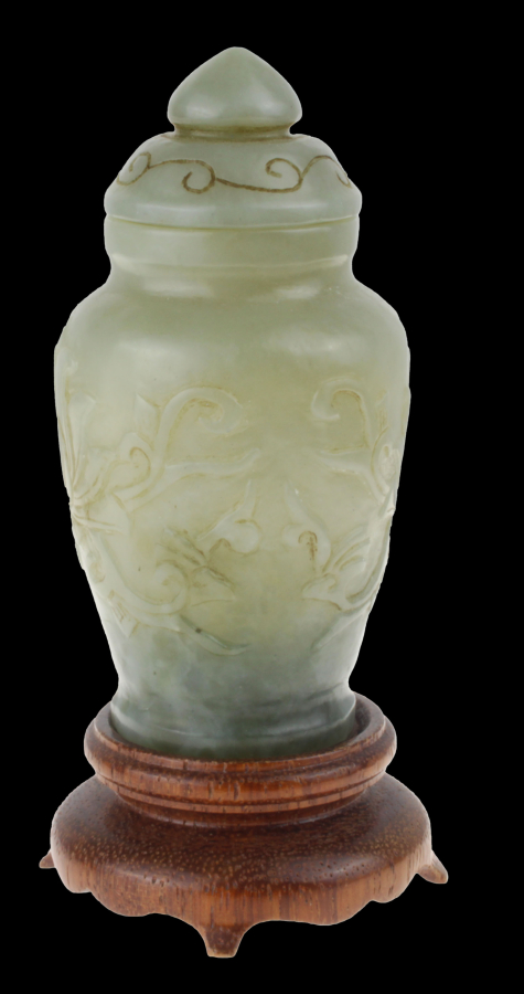 Chinese jade bottle on wooden stand